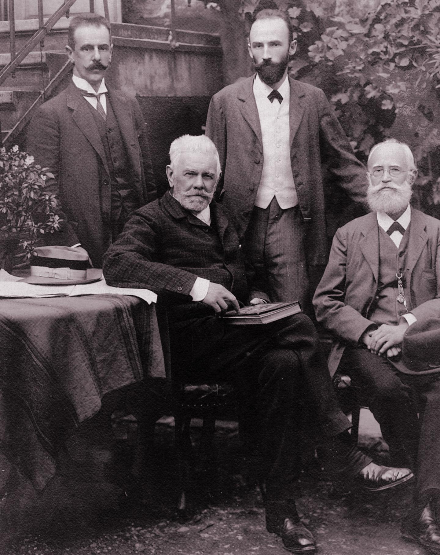 Photo showing Ludwig Bösendorfer, Technical Director Franz Berger, Berger's son Carl Georg (middle) and Carl Hutterstrasser (standing, left)