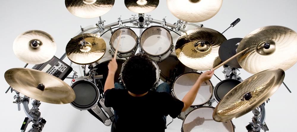Photo of a drummer playing a large drum hybrid drum kit