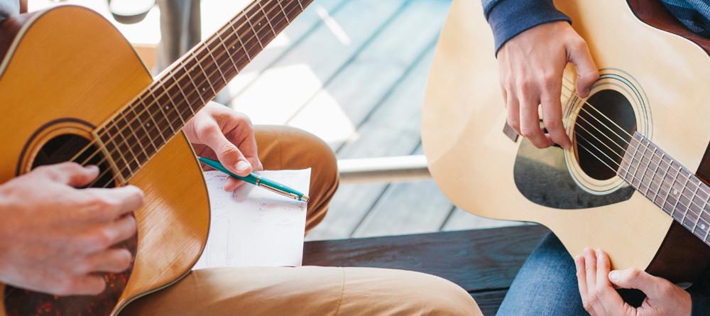 Photo of a guitar lesson in progress