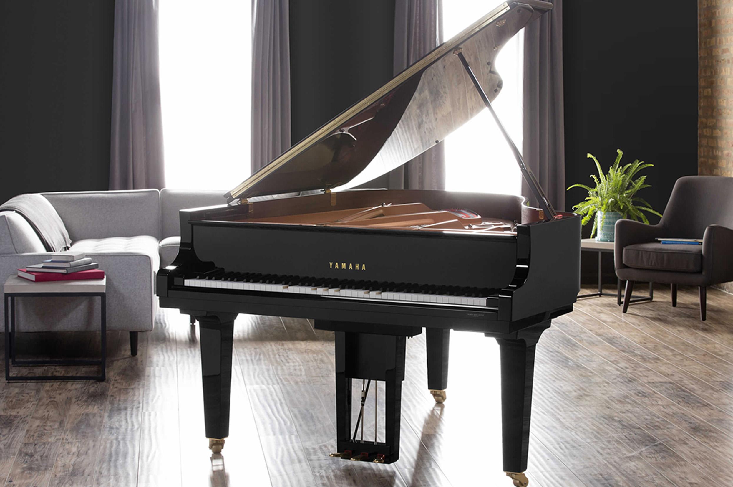 Photo of a Yamaha Disklavier Grand piano in a contemporary living room