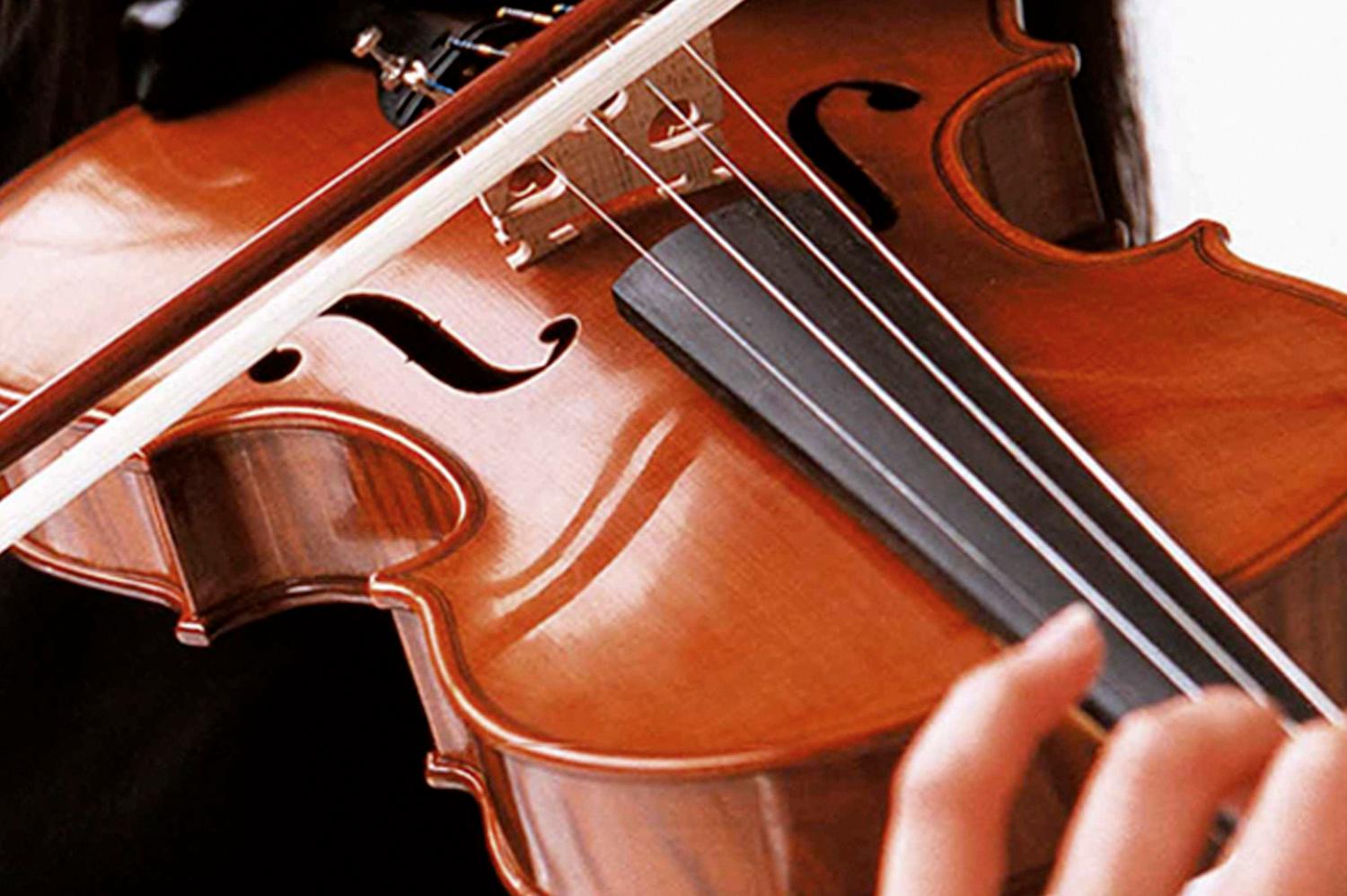 Close-up of a violin being played