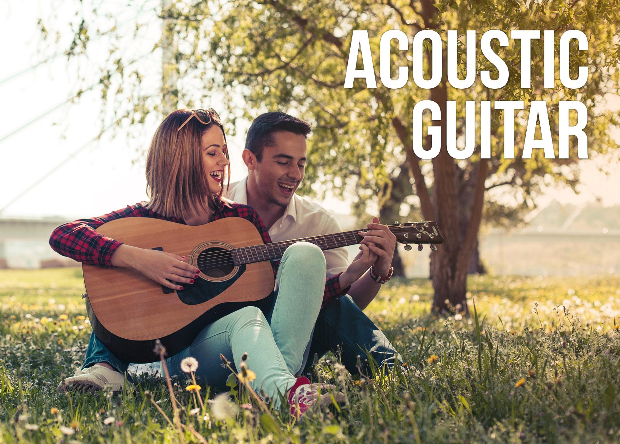 A couple playing a Yamaha acoustic guitar in a park