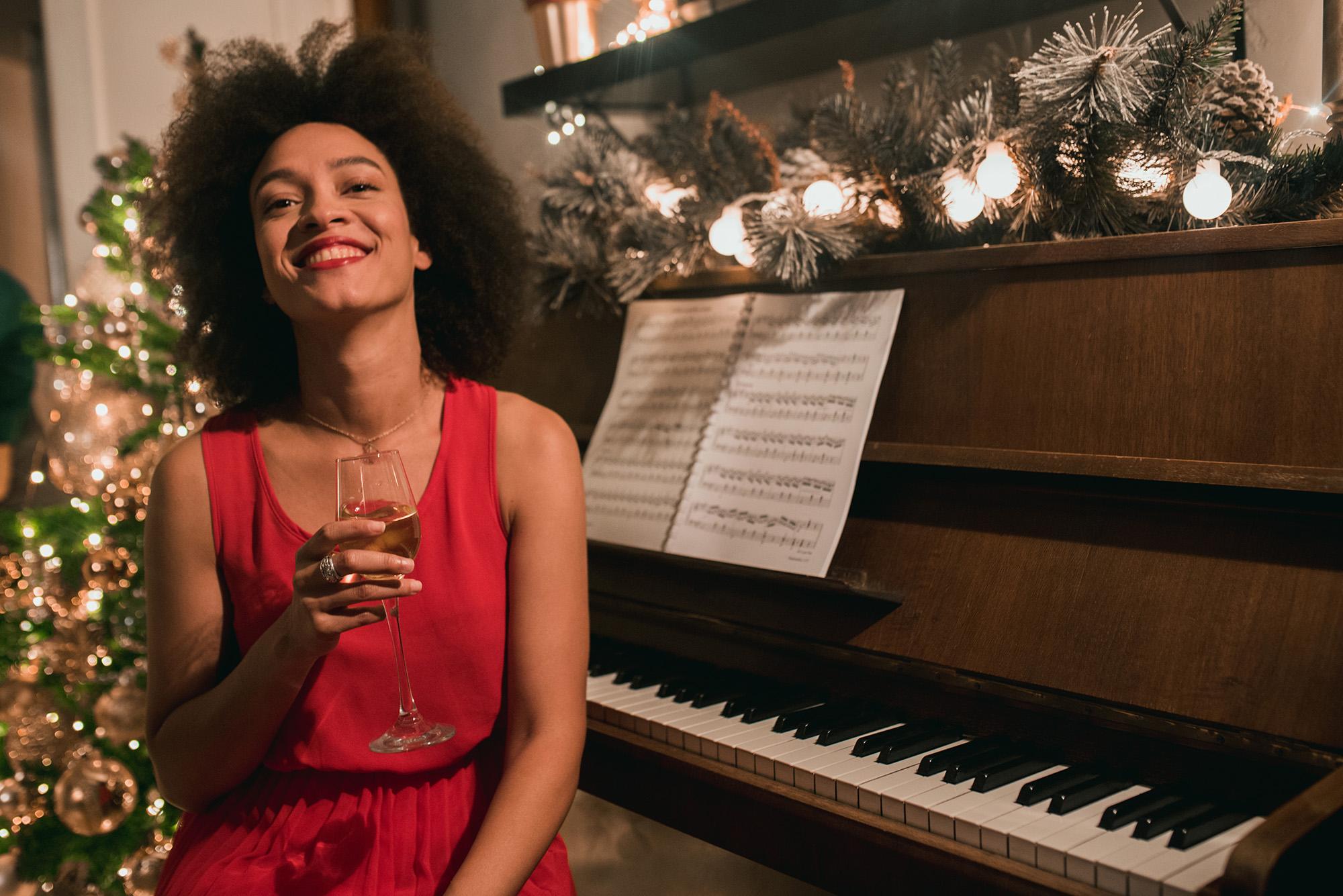 A woman ready to play piano at Christmas time